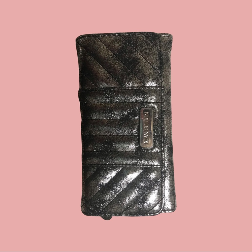 This is a Wallet by Max Edition. New with tags. black with silver sheen.